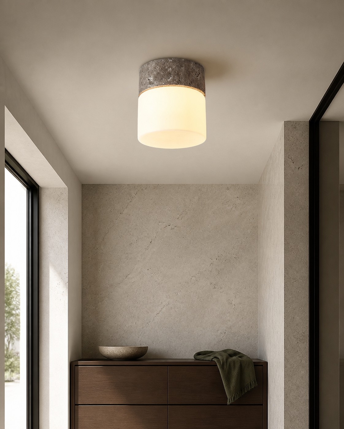 Natural travertine flush mount ceiling light in a compact interior