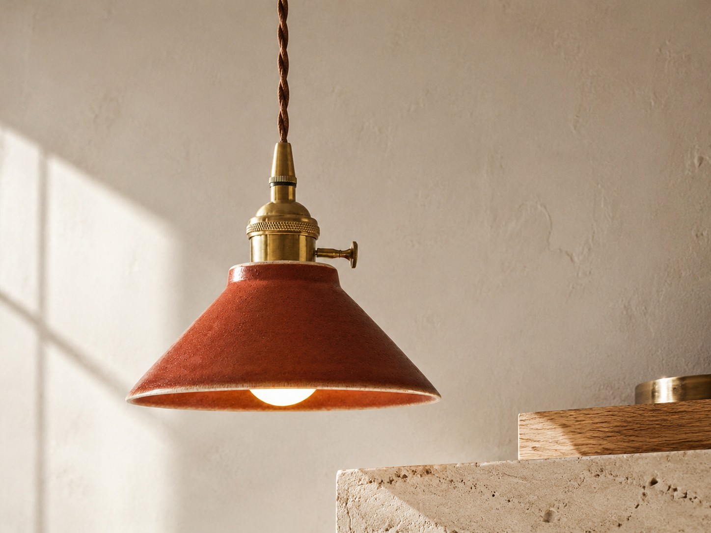 Glazed ceramic pendant with antique brass details