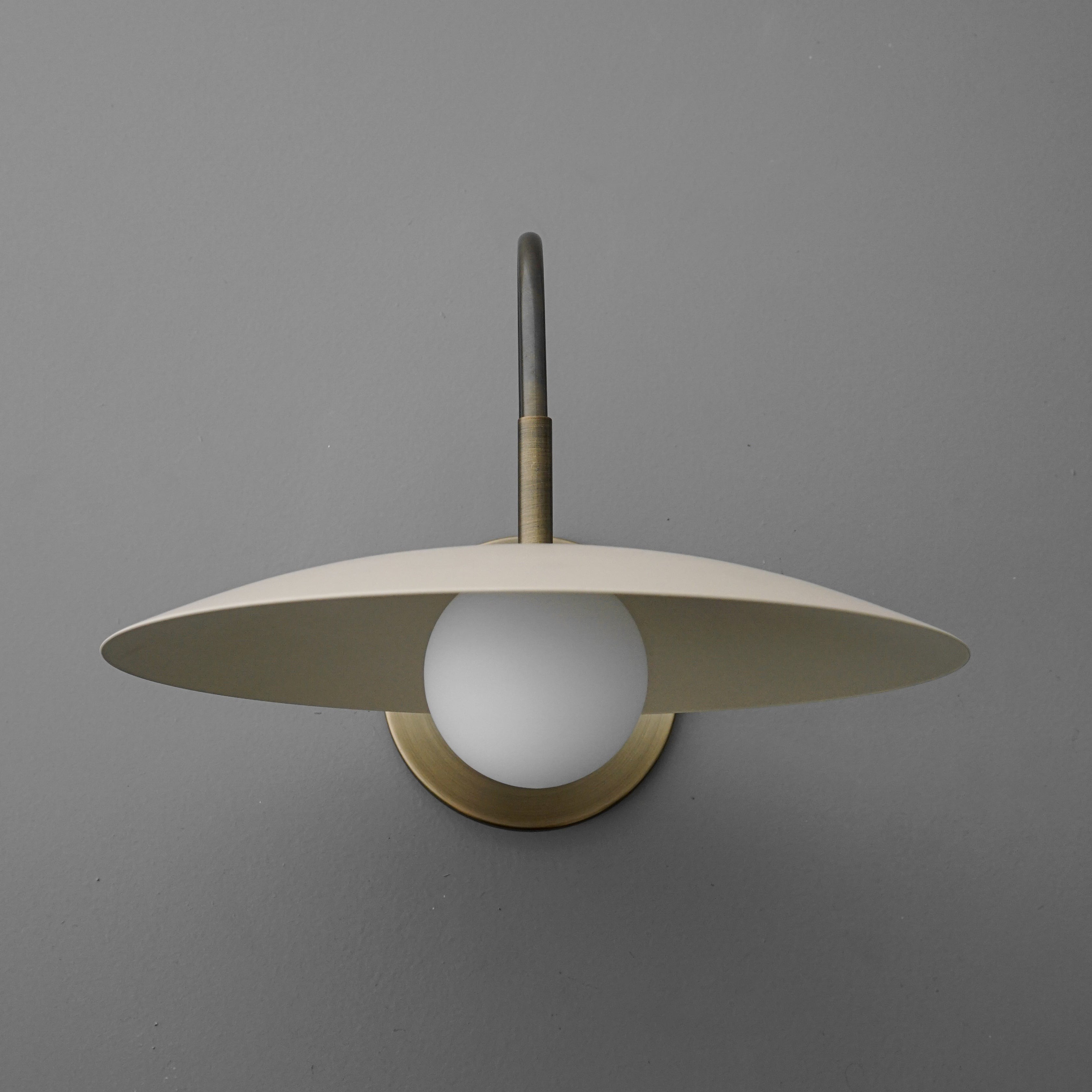 Curva Metal Modern Wall Sconce - Antique Brass Arm with Cream Disc Shade K1540