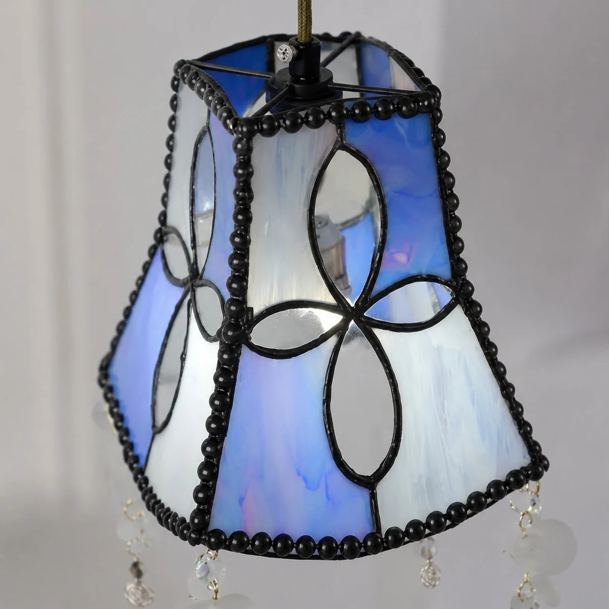 Lit shade detail with blue white shell panels