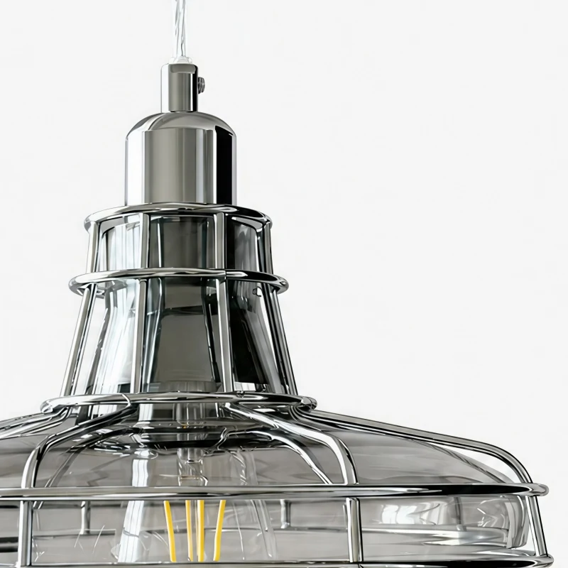 Close-up of iron cage and glass shade