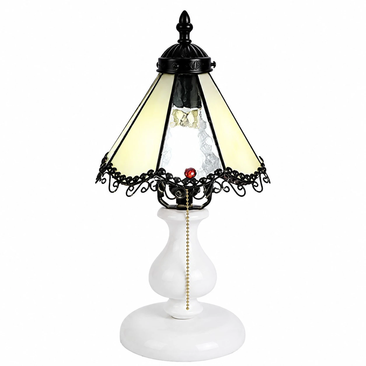 Pale yellow vintage stained glass table lamp on a white background