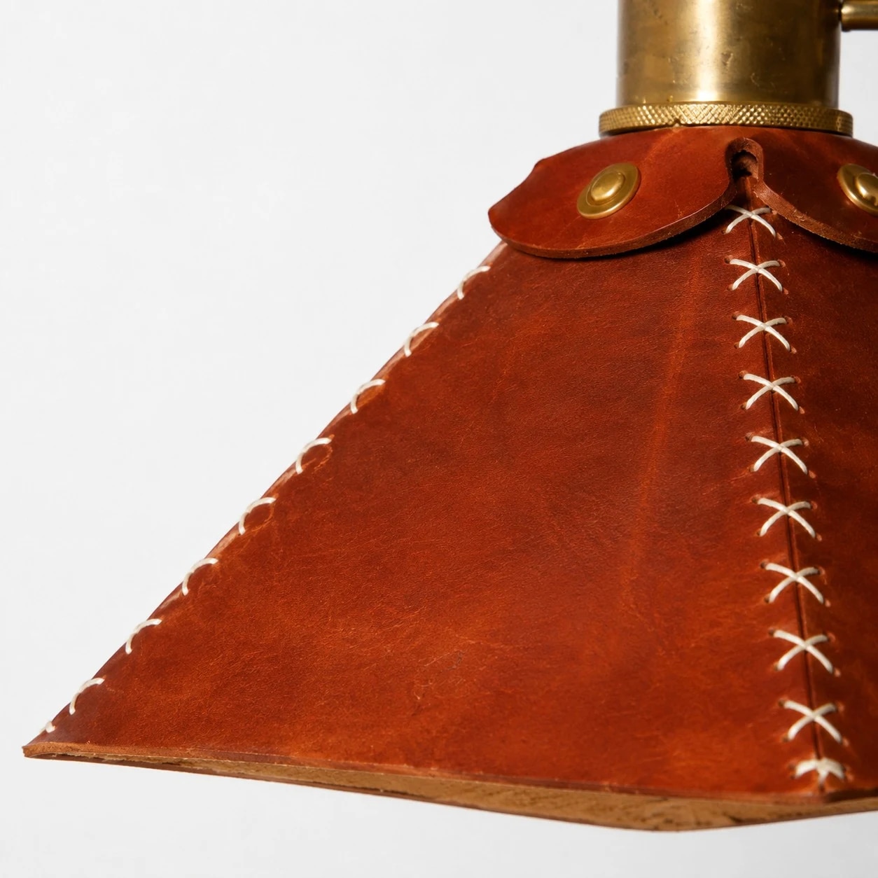 Close detail of leather shade stitching and edge