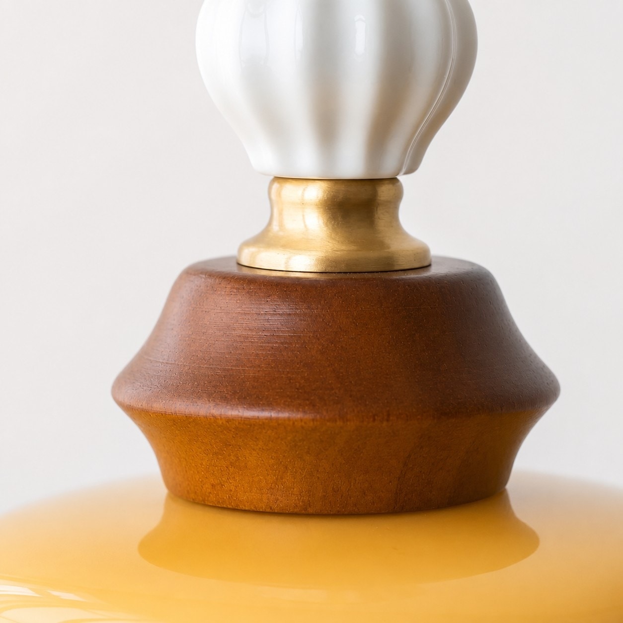 Solid wood cap and ribbed glass detail on pendant light