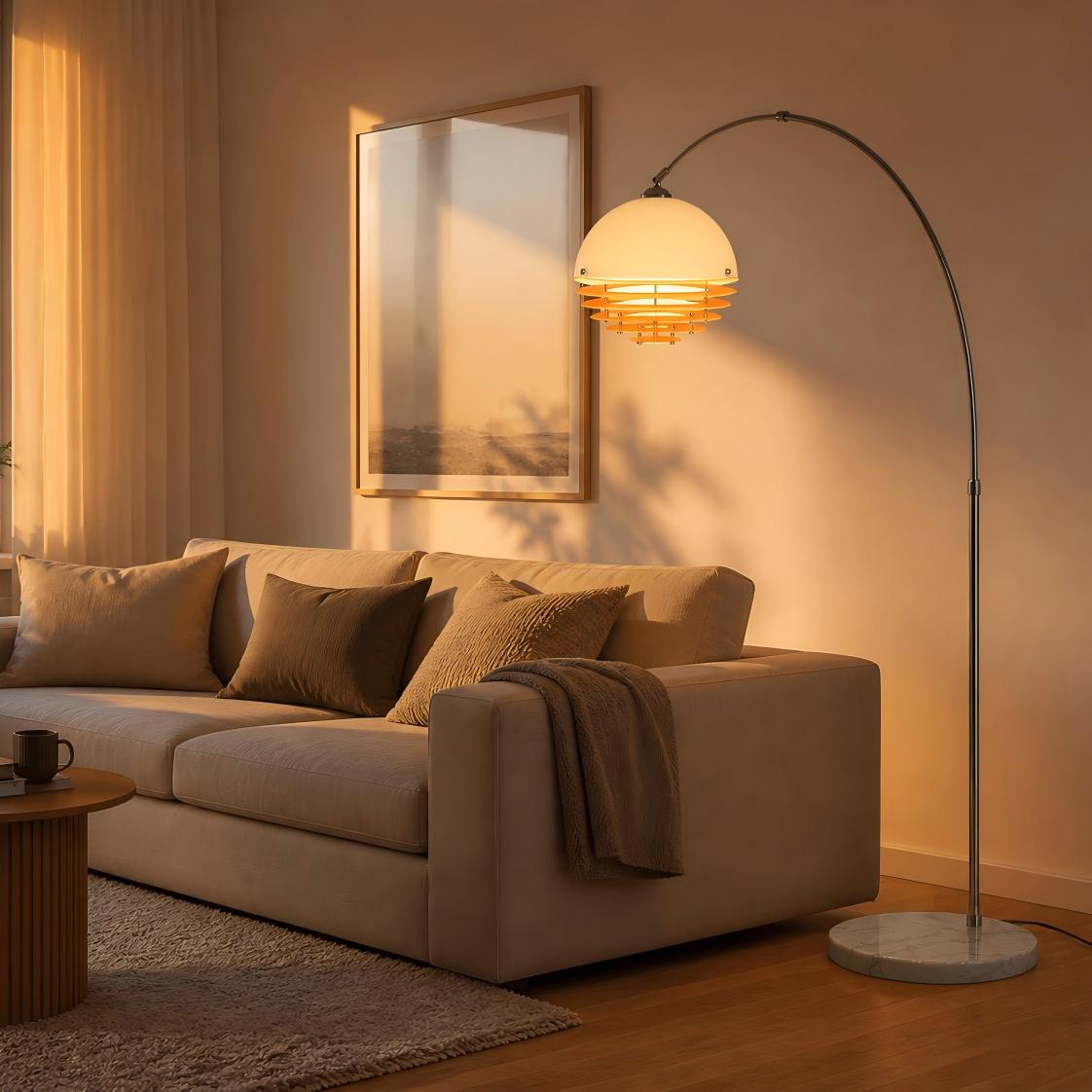 Arc floor lamp adding warm light beside a sofa