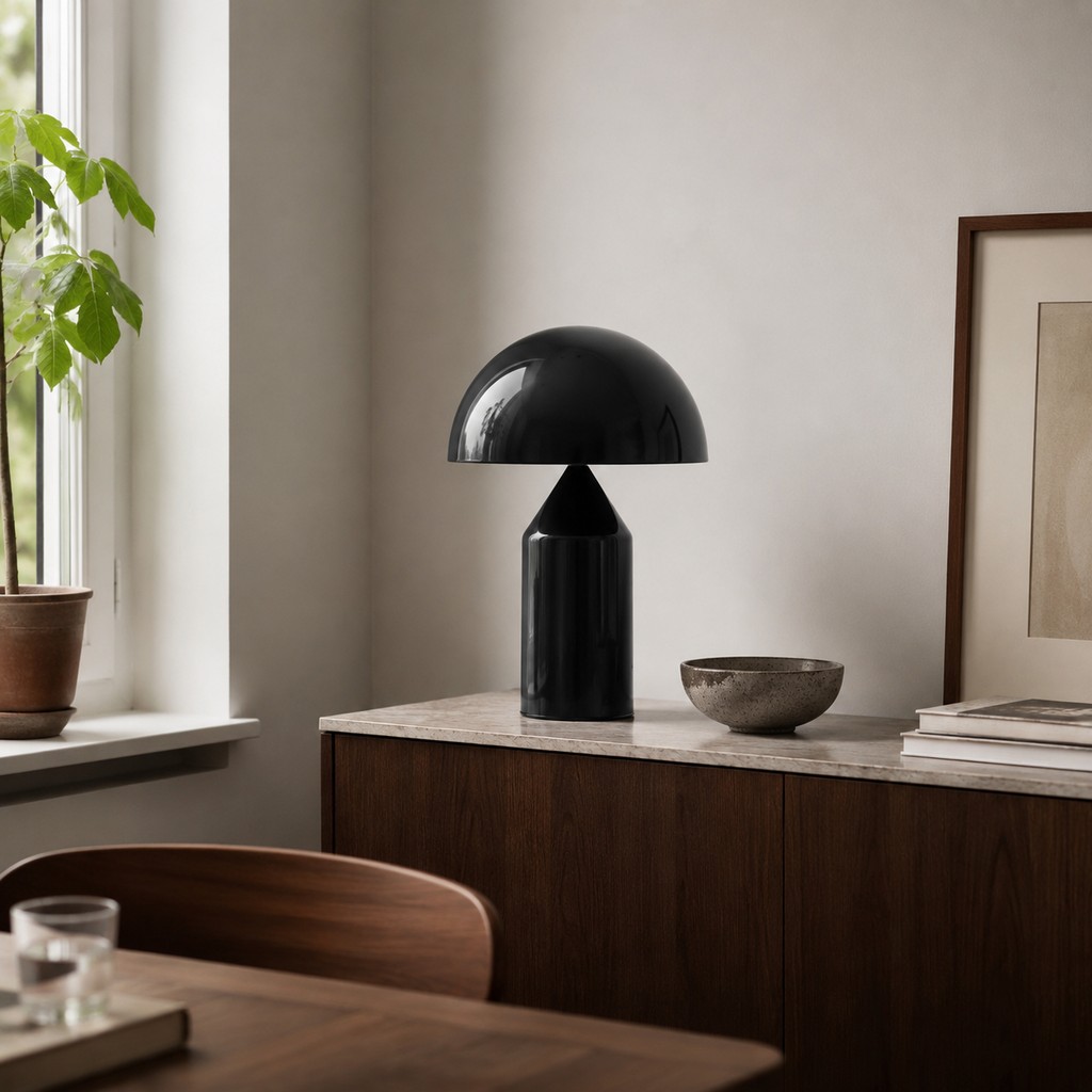 Black dome table lamp on a dining room sideboard