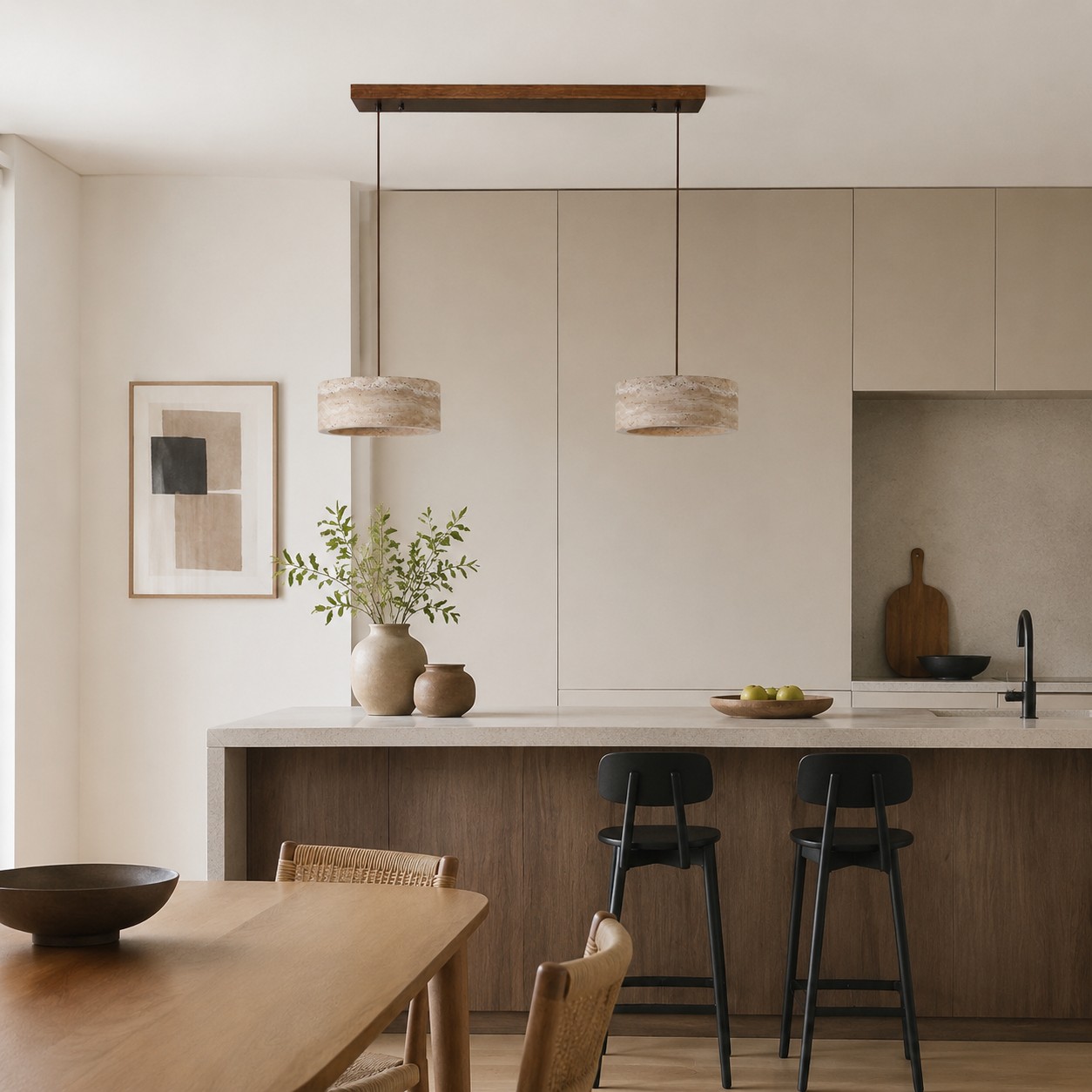Two-light yellow travertine linear pendant over a kitchen island