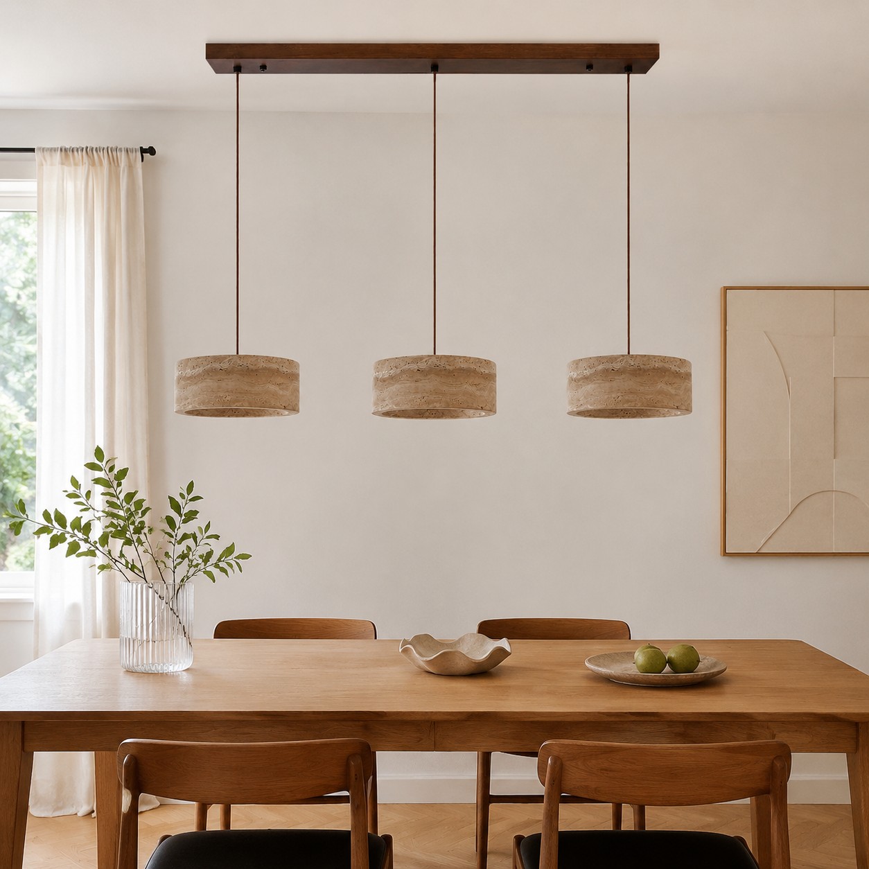 Three-light yellow travertine pendant over a long dining table