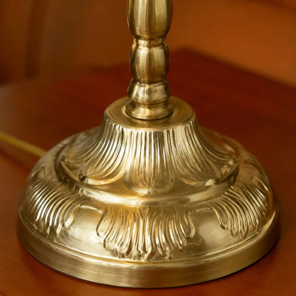 Antique brass tone metal lamp base detail