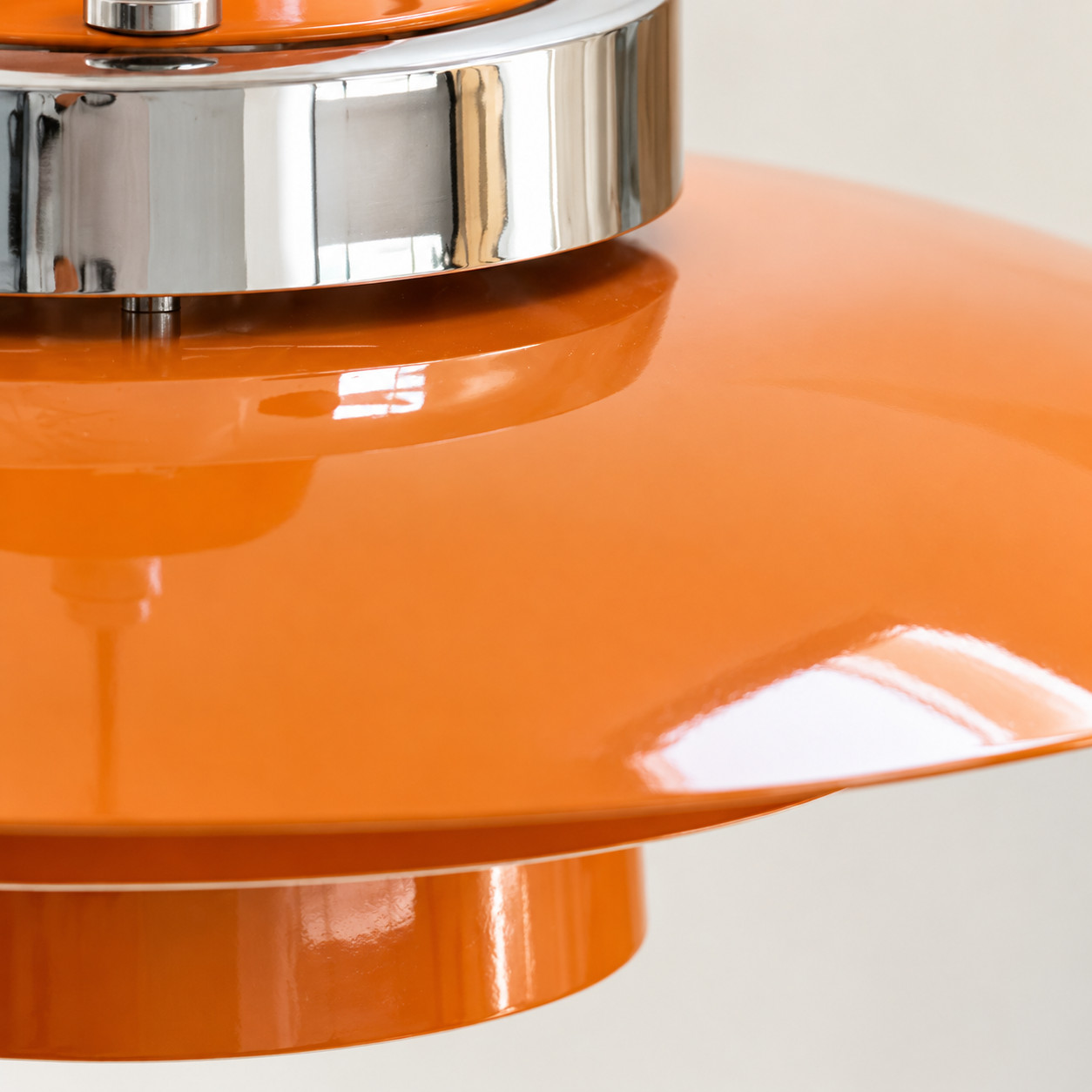 Orange metal pendant shade close-up