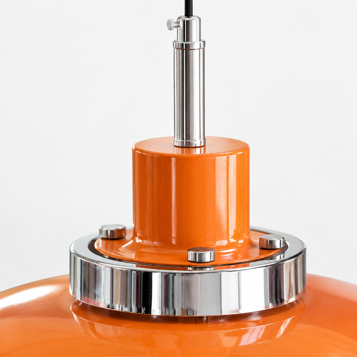 Chrome connector and orange metal shade detail