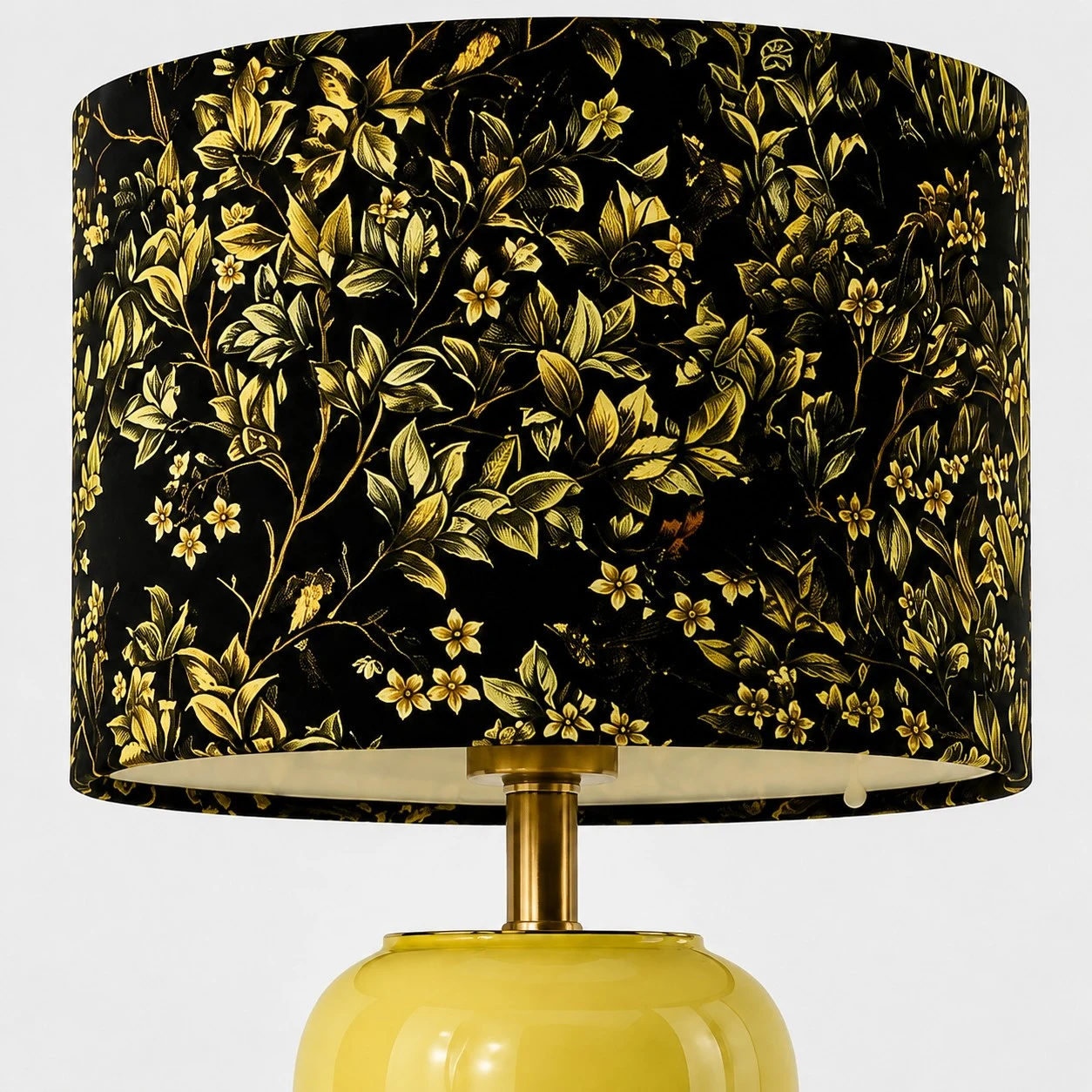 Close view of the floral shade and glossy ceramic table lamp base