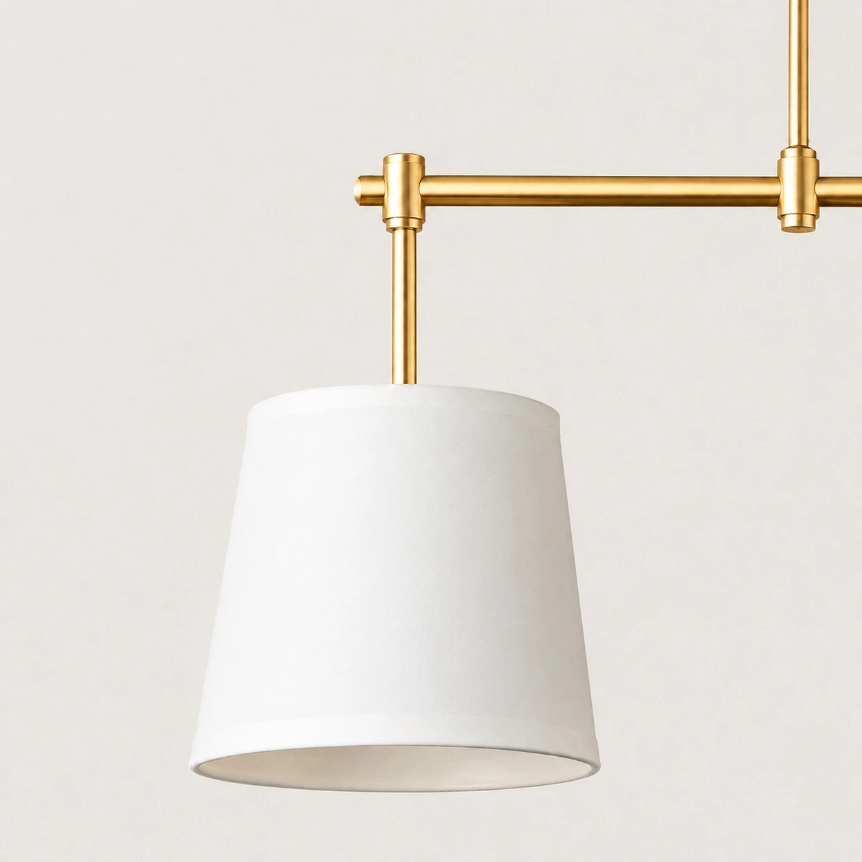 Dumora fabric shade and antique brass arm close view